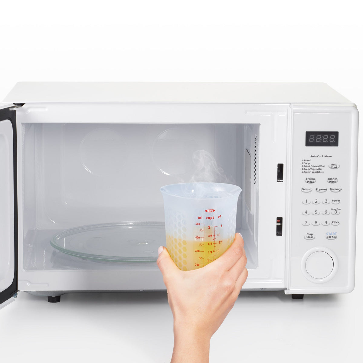 2-cup-squeeze-and-pour-silicone-measuring-cup-v3 oxo_good_grips_silicone_measuring_cup_-_in_microwave.jpg